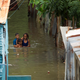 Picture taken in the flooded neighbourhood of La Puya, in Santo Domingo on October 4, 2016 after the passage of Hurricane Matthew through Hispaniola — the island that the Dominican Republic shares with Haiti. Matthew, a Category Four hurricane, slammed into the Dominican Republic and Haiti Tuesday, triggering major floods and forcing thousands to flee the path of the storm that has claimed at least three lives in each country.(Image: Getty)